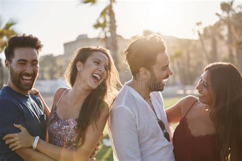 Two Happy Couples Having Fun Outside Laughing Stock Image Image Of