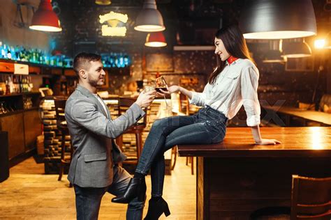 Woman Flirting With Man Couple At Bar Counter Stock Image Colourbox