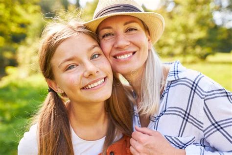 Mother And Daughter Smile Happily And Familiarly Stock Photo Image Of