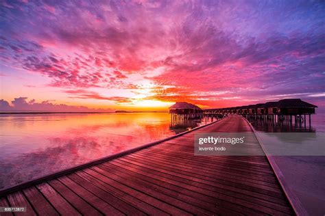 Sunset On Maldives Island Water Villas Resort Beautiful Sky And Clouds