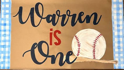 A Sign With A Baseball On It That Says Warmen Is One