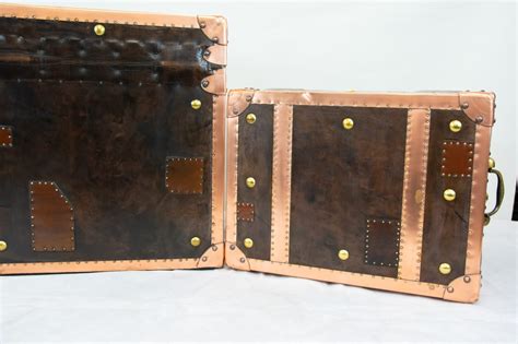 Breast side by side offering superior versatility. Pair Luggage Boxes - Steamer Trunk Copper Leather Cases Table