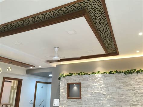Prepare the ceiling to hold the faux beams by installing 2x4 boards or covering an lvl beam. POP False Ceiling Design with Wooden & MDF Jali Designed ...