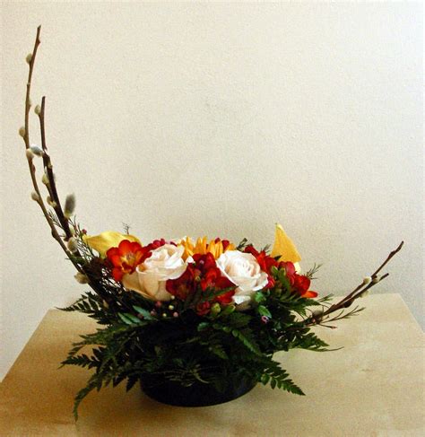 It can be an 'a' shaped design in a tall container, which is very nice as an altar flower arrangement for a church or wedding ceremony. New Garden Club Journal: Traditional Design - Crescent