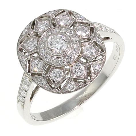 With style art deco or nature inspired. Platinum 0.53ct oval art deco style diamond cluster ring. - from Mr Harold and Son Jewellery UK