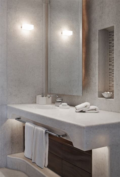 Its wide 60 design is made from solid poplar wood in a neutral finish, and the surface is crafted from stone in a carrara white finish that complements your contemporary decor. The Luxury Look of High-End Bathroom Vanities