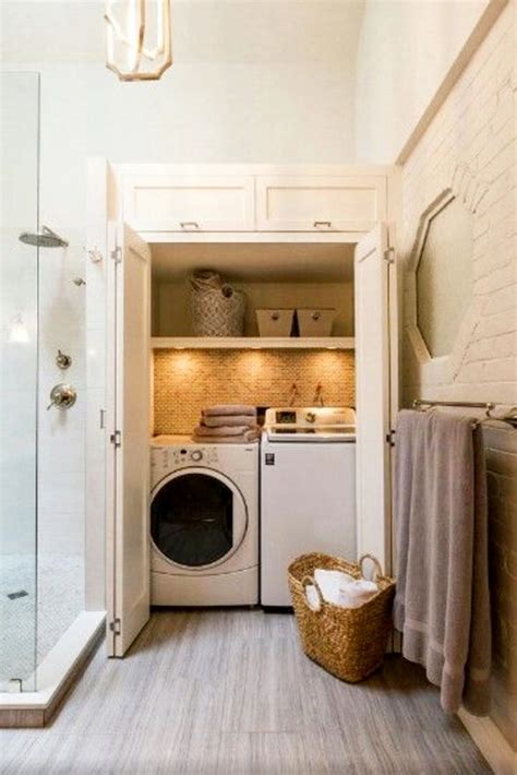 This little room calls to mind an old fashioned outhouse/wash house with its weathered, white painted boards on the walls and the cabinets. Laundry Nook Ideas We LOVE - Clever DIY Ideas