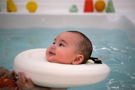 Baby Enjoying In The Jacuzzi Spa For Babies Hydrotherapy Session For