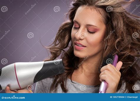 Brunette Woman Blow Drying Her Wavy Hair Stock Photo Image Of