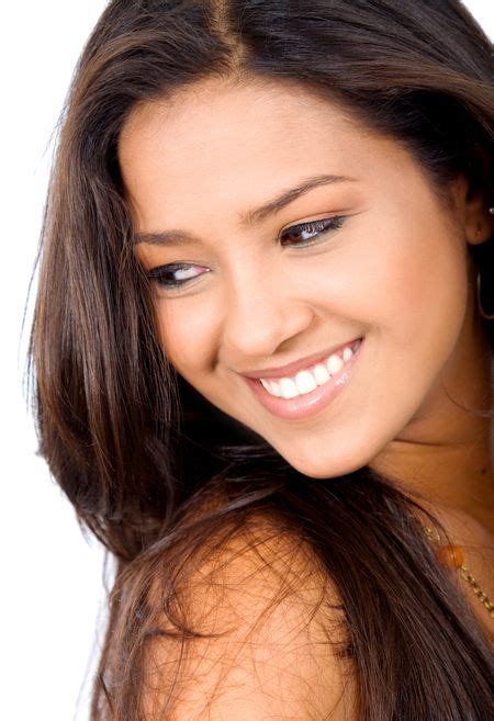 Beauty And Fashion Portrait Of A Beautiful Latin American Girl Who Is Smiling And Isolated Over
