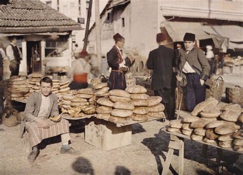 An Old Time Photo Of People Selling Bread