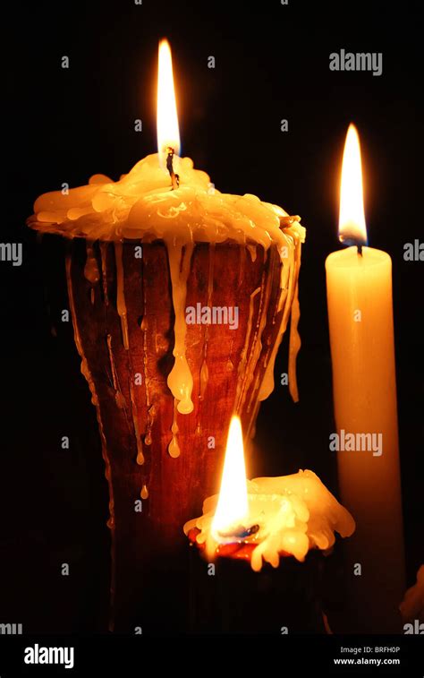 Burning Candles On Black Stock Photo Alamy