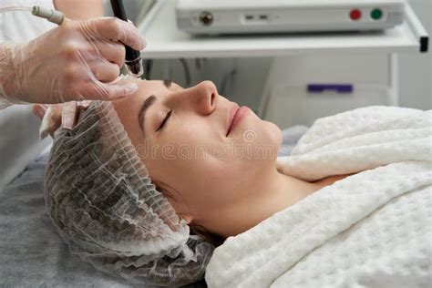 Woman Getting Facial Hydro Microdermabrasion Peeling Treatment At Cosmetic Beauty Spa Clinic