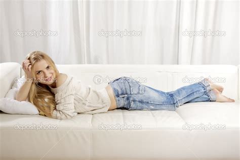 Beautiful And Attractive Blonde Woman Posing In Blue Jeans Dress Stock Photo Bartekwardziak