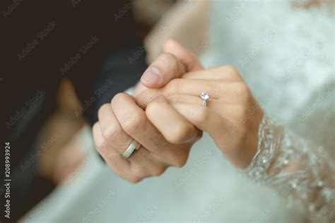 Young Married Couple Holding Hands Ceremony Wedding Day Photograph By