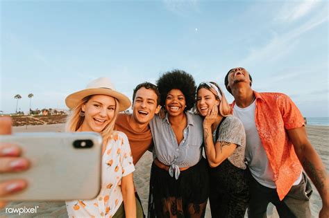 Download Premium Image Of Group Of Diverse Friends Taking A Selfie At The Beach Photography