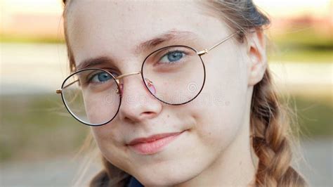 A Teenage Girl Wearing Glasses Close Up Of Her Face Stock Photo