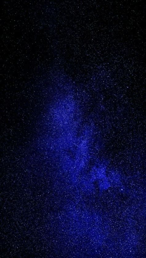 The Night Sky Is Filled With Bright Blue Stars