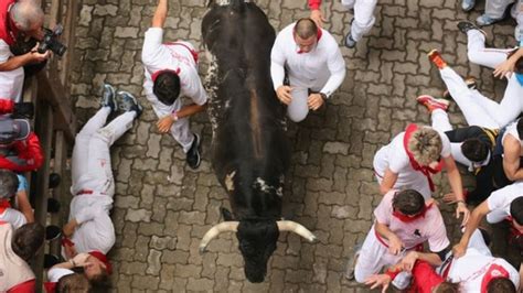 Pamplona Bull Run Sees Thousands Brave A Trampling Bbc News