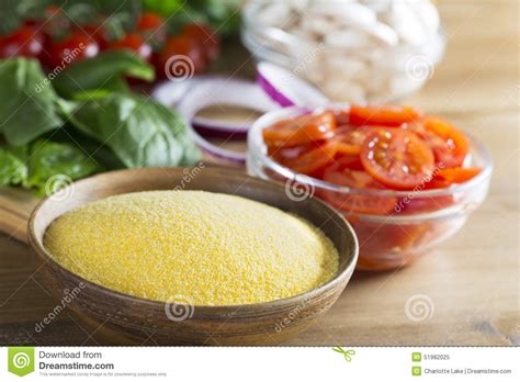 Polenta is very easy to make, once you get past the notion of all the stirring it requires. Raw Polenta And Sliced Tomatoes Stock Image - Image of ...
