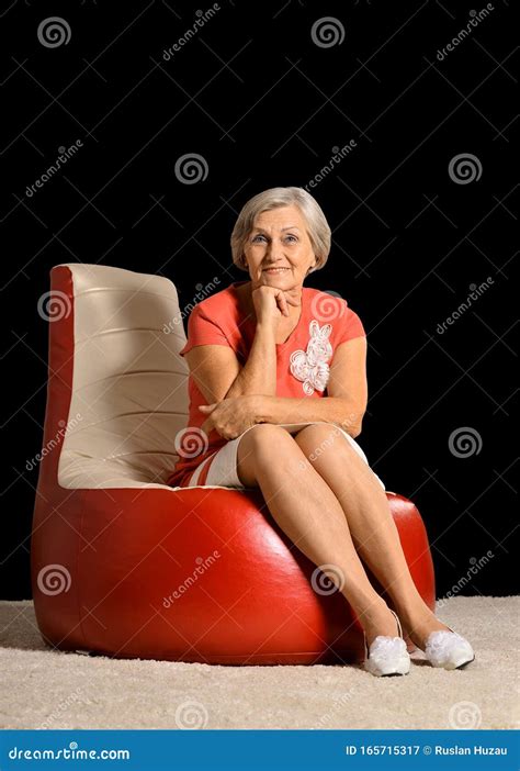 Portrait Of Beautiful Senior Woman On Chair In Studio Stock Image Image Of Older Grandmother