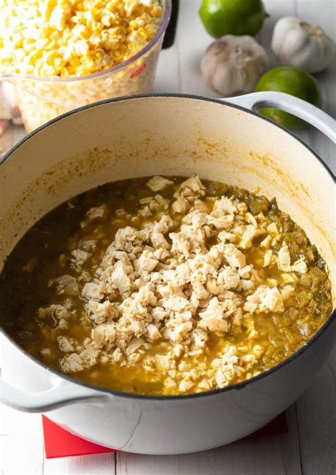 Made with grilled sweet corn, roasted red pepper, cojita cheese and a chili lime cream sauce this equites recipe is bursting with flavor in every bite! Mexican Street Corn Chicken Chili Recipe - A Spicy Perspective