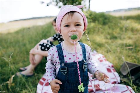 Funny Little Girl With A Pacifier In Her Mouth Stock Image Image Of