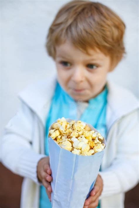 Happy Little Boy With Popcorn Bag Stock Photo Image Of Watch Youth