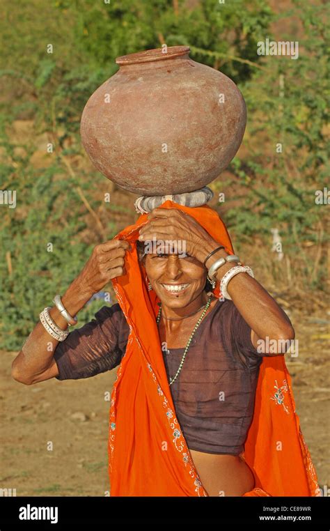 INDIA Rajasthan Ranthambhore National Park Local Woman Carrying
