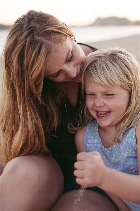 Babe Mom And Babes Enjoying Each Other On The Beach At Suns By Stocksy Contributor Rob