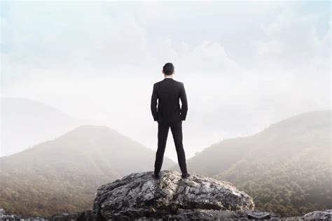 Business Man Standing On The Top Of The Mountain Stock Image Everypixel