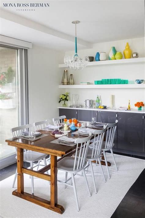 If you've got a formal dining or living space, glass. Chic dining room features long, white floating shelves ...