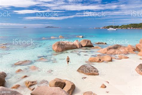 Woman Enjoying Anse Lazio Picture Perfect Beach On Praslin Island Stock