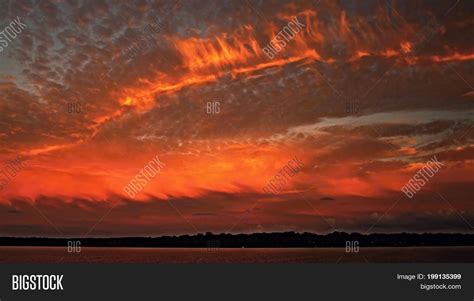 Orange Cloudy Sunset Image And Photo Free Trial Bigstock