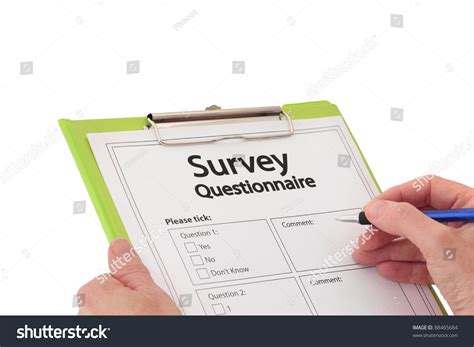 Hand With Pen Completing Market Research Survey ...