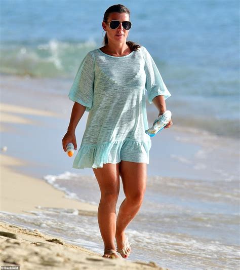 coleen rooney shows off her curves in a black bikini while soaking up the sun in barbados