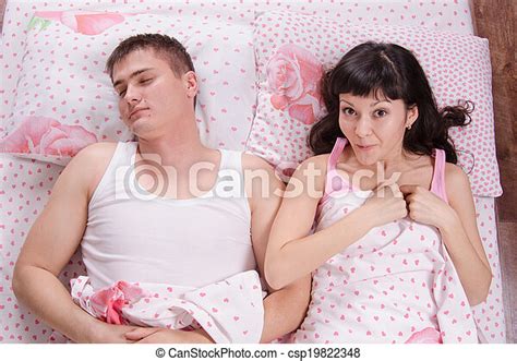 Girl With Surprise Woke A Sleeping Man In Bed A Young Girl Waking Up