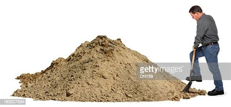 Middle Aged Man Digging In Pile Of Dirt Using Shovel High Res Stock