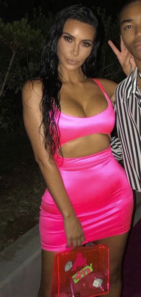 kim kardashian wearing a neon pink bright fuchsia dress at kylie jenner s birthday party