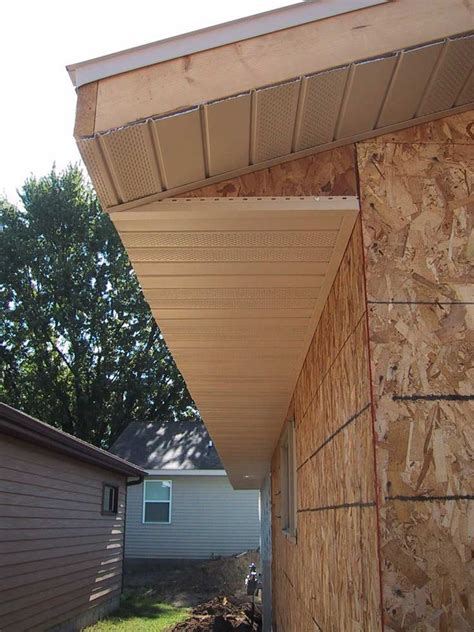 The Side Of A House That Is Covered In Plywood