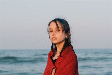 teenager girl in a towel by the sea at sunset girl in a red towel stock image image of beach