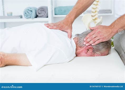 Physiotherapist Doing Neck Massage To His Patient Stock Image Image Of Senior Holding 54760157