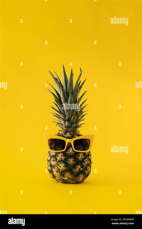 Fresh Pineapple With Sunglasses On Yellow Background Minimal Summer
