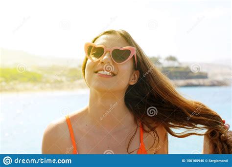 Pretty Brunette Woman In Pink Heart Sunglasses On The Beach Holidays