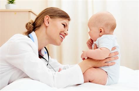 Find the ticket clinic office near you. Portrait of little baby with doctor therapist in clinic ...