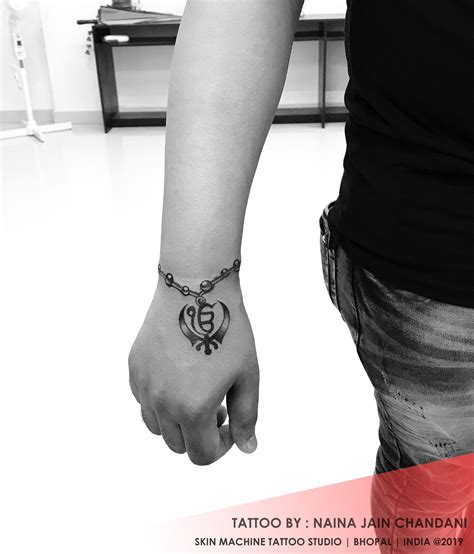 Browse our khanda tattoo images, graphics, and designs from +79.322 free vectors graphics. Khanda Tattoo in 2020 | Tattoo studio, Tattoos, Tattoo ...