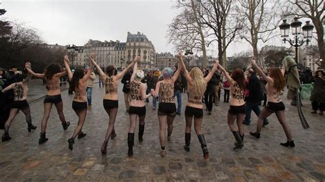 Topless Women Activists Bang Notre Dame Bell In Anti Pope Protest In