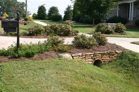 Field Stones And Landscaping Add A Nice Touch To Driveway Culverts