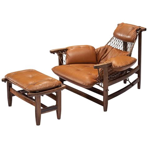 Add even more comfort to your space with outdoor ottomans and accent tables. Jean Gillon Jangada Lounge Chair with Ottoman in Cognac ...
