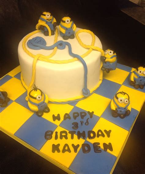 Goldilocks bakeshop is a bakery chain based in the abstract white background design with modern angles and layer shapes with gray grunge texture. Minions cake.